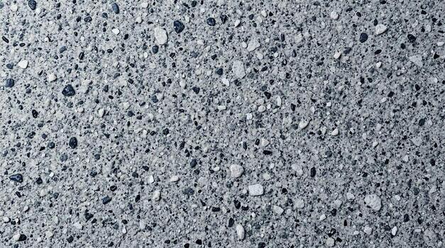 Aggregate Texture A CloseUp View of Small Stones Embedded in a Gray Surface photo