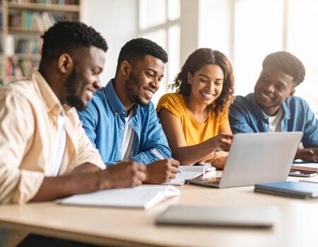 Collaborative university students engaged in group study, sharing ideas and working together on laptop. atmosphere is positive and focused, highlighting teamwork and learning photo