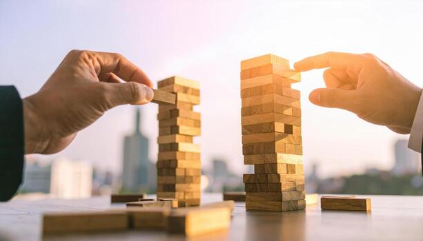 Wooden block game strategy hand tower building concept with city background in sunlight photo