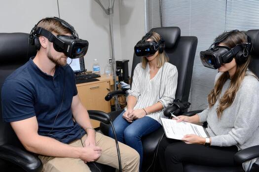 Virtual reality testing in a modern office with participants engaged in immersive experience photo