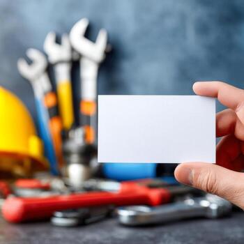 Plumber business branding close-up showcasing tools and a blank business card photo