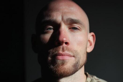 A man with a beard and a military uniform photo