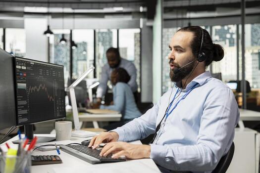 Trader working for brokerage company talking with clients, explaining stock market trends through headset mic. Man analyzing market options and recommends tailored investment strategies for customers photo