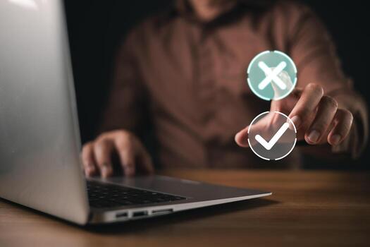 businessman interacts with a futuristic touchscreen interface, selecting a checkmark over a cross symbol, representing decision-making, approval, and digital choices in technology driven environments. photo