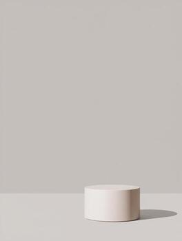 Minimalist beige cylinder podium with soft shadow on neutral background photo
