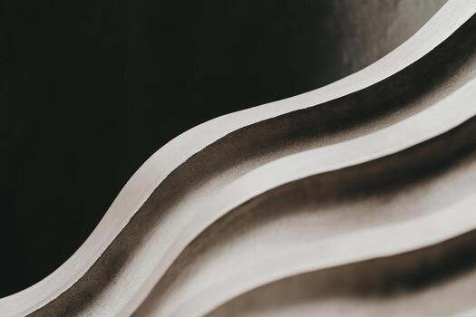 Curved lines and textures create a captivating abstract design in neutral tones photo