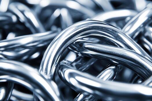Close-up view of interwoven metal chains showcasing their smooth, shiny surfaces photo