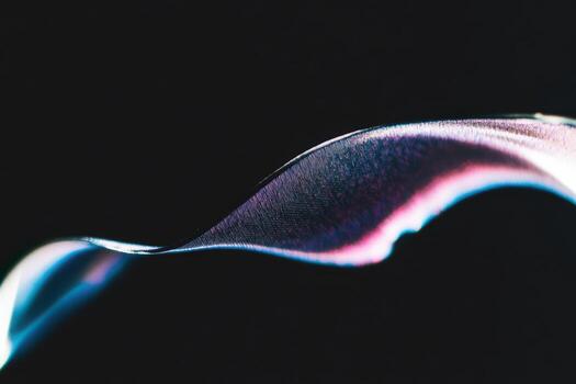 Creative abstract view of metallic surface with flowing colors and light photo