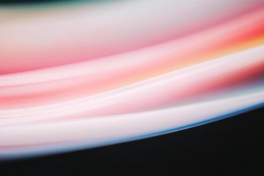 Abstract flowing lines in soft pastel colors on a dark background photo