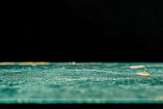 Close-up view of textured surface showing grain and small particles photo