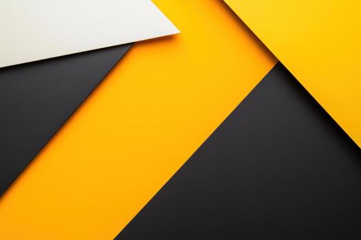 Bold geometric patterns created with black, yellow, and white paper sheets photo