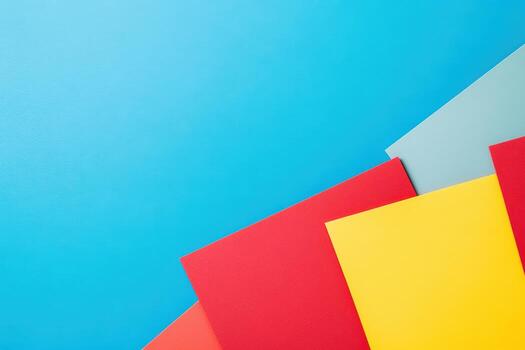 Colorful sheets of paper arranged creatively on a blue background photo