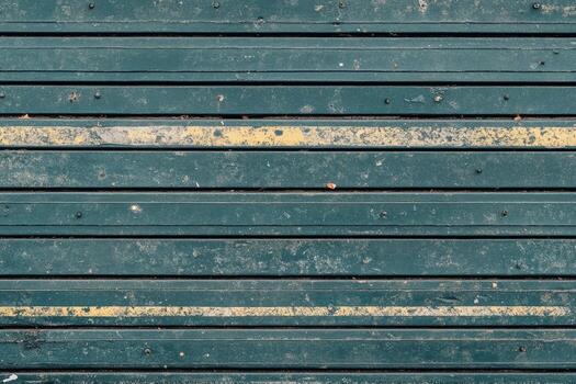 Wooden floor with yellow lines marking separation in urban setting photo
