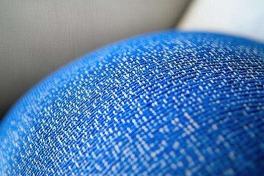 Textured blue fabric close-up showcasing intricate weave patterns photo