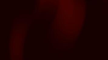 lynnig abstrakt bakgrund i djup röd och svart toner med slät lutning övergångar och mjuk skuggor. elegant, minimal se idealisk för dramatisk eller med lyxtema mönster. video