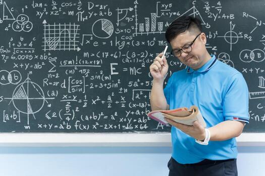 Mathematics teacher solving complex formulas on blackboard, education concept with knowledge learning photo