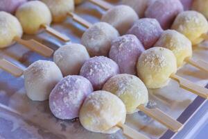 skewer of round daifuku mochi, japanese dessert. photo
