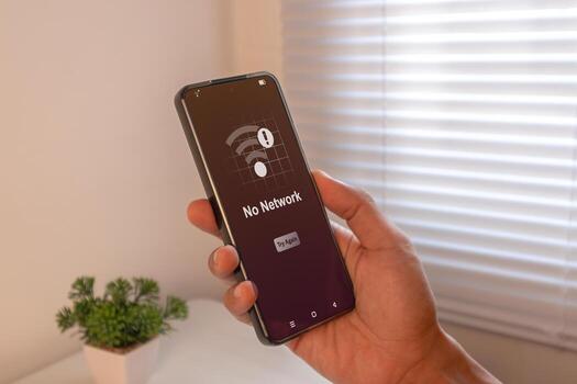 No network, No internet access or bad connection concept. Hand holding mobile phone with No Network notification. photo