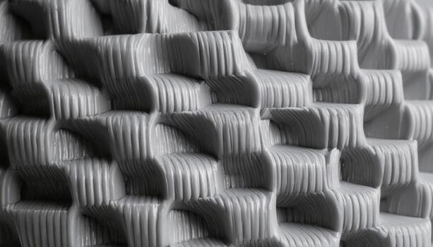Close up 3D printed filament layer stepping gray wallpaper background representing plastic texture detail suitable for modern industrial design photo