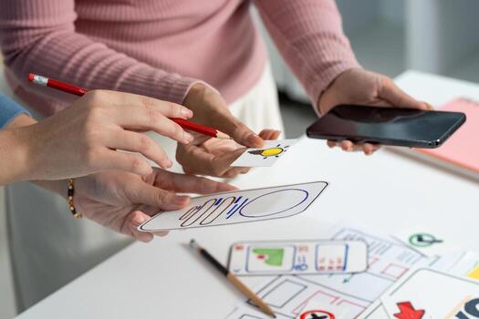 UX and UI Design Process with Sketches and Smartphone photo