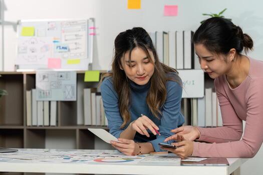 UX and UI Design Discussion with Sketches and Smartphone photo