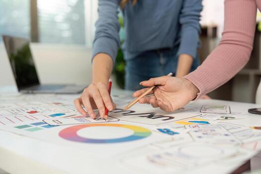 Collaborative UX and UI Design Session. Designers working together on wireframes and prototypes. photo