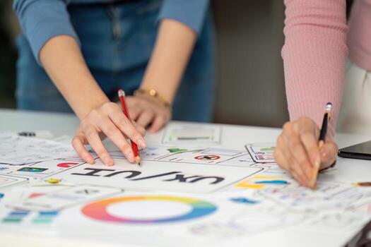 UX and UI Design Collaboration. Creative team brainstorming on user interface concepts. photo