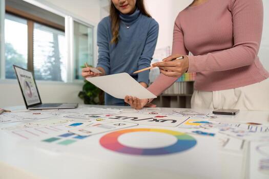 UX UI Design Collaboration. Creative team brainstorming on user interface concepts. photo