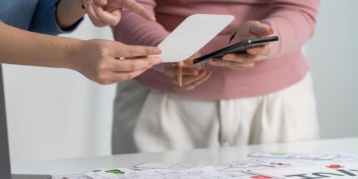 UX and UI Design Collaboration with Smartphone and Sketches photo