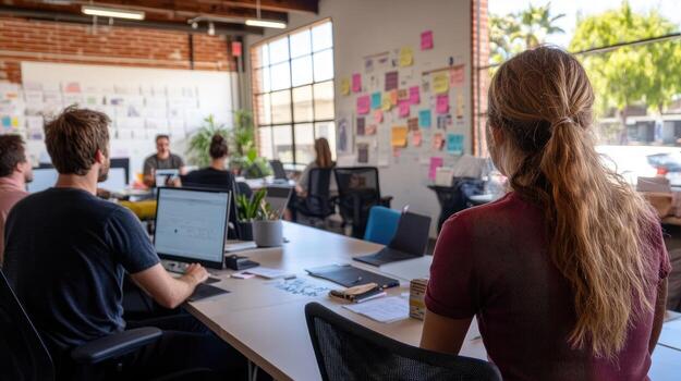 Collaborative workspace teamwork in a modern office environment featuring diverse professionals working on computers photo