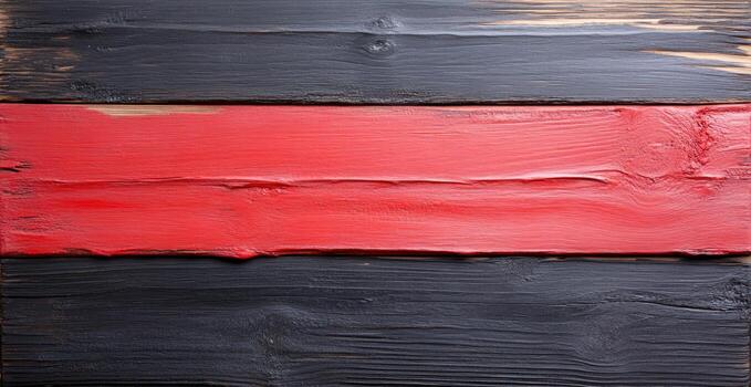 Textured wooden background with horizontal planks painted black and vibrant red creating a contrasting rustic surface design for copy space photo