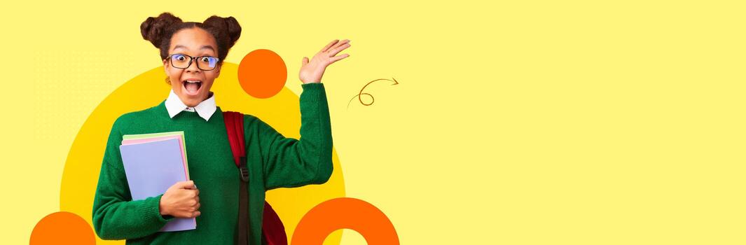 A student with glasses and playful hairstyle happily waves while holding books in a colorful setting. The vibrant backdrop and excited expression reflect the joy of learning in a modern environment. photo