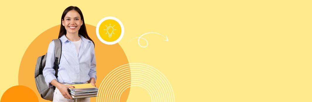 A student smiles while holding various study materials in a vibrant, modern environment. This setting reflects the new normal in education, with a cheerful background design enhancing motivation. photo