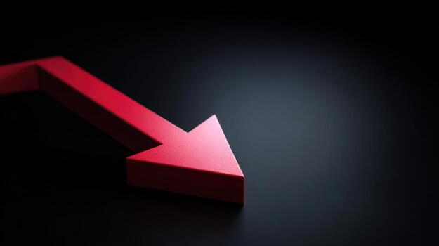 Red arrow pointing downward on dark background photo