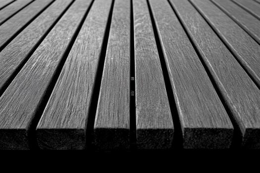 Wooden slats in dark tones create a textured surface in a minimalist setting photo