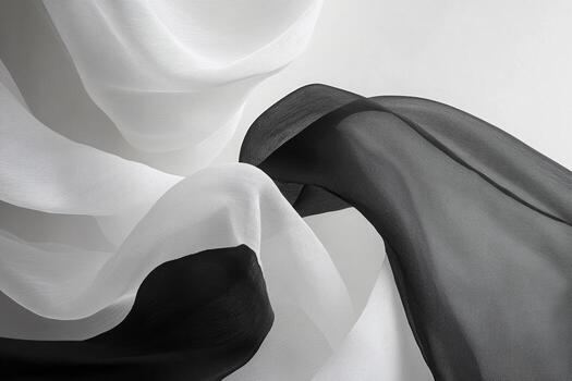 Flowing black and white fabric drapes create elegant textures and patterns photo