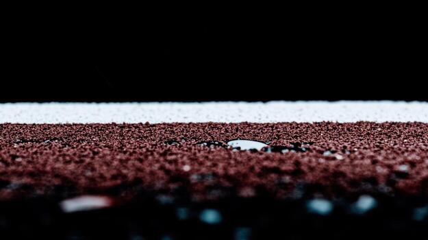 Texture of red and white granules with water droplets under soft light photo