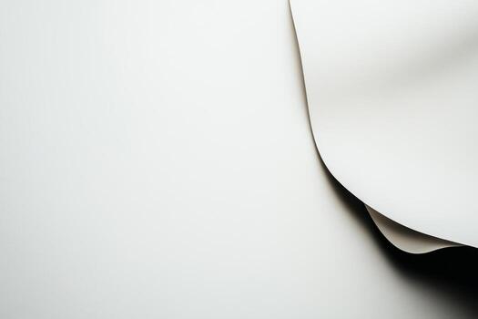 Smooth white paper draped artistically on a minimalist surface photo