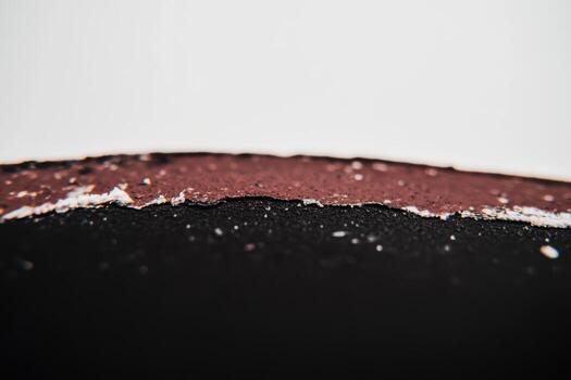 Close-up view of torn paper with textured layers in an artistic composition photo