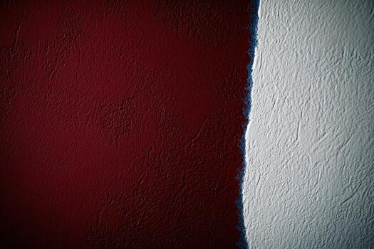 Bold color contrast on a textured wall showing red and white paint photo