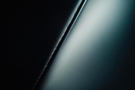 Textures of dark leather creating an abstract visual experience in a dim setting photo