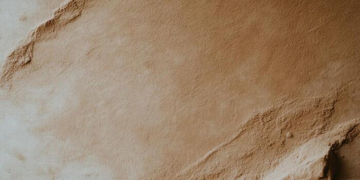 Brown textured surface with natural patterns and soft lighting in warm tones photo