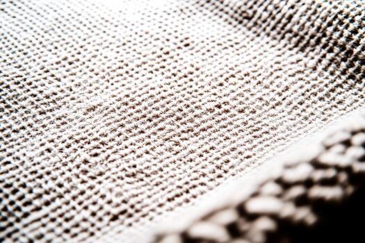 Textured fabric close-up showing intricate patterns and fibers during daylight photo