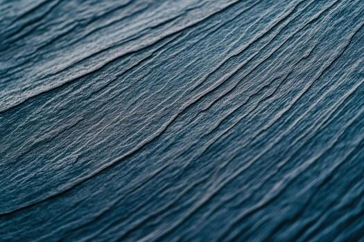 Abstract texture of dark blue slate with intricate patterns and lines photo