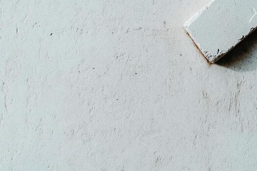 Texture of a rough white wall with a rectangular shape on the surface photo