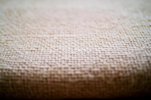 Textured fabric close-up reveals intricate weave pattern and natural fibers photo