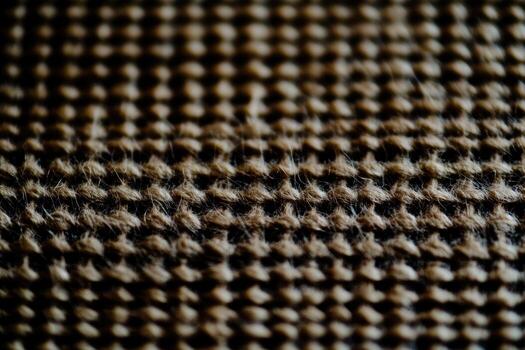 Detailed close-up of woven texture showcasing intricate patterns and colors photo