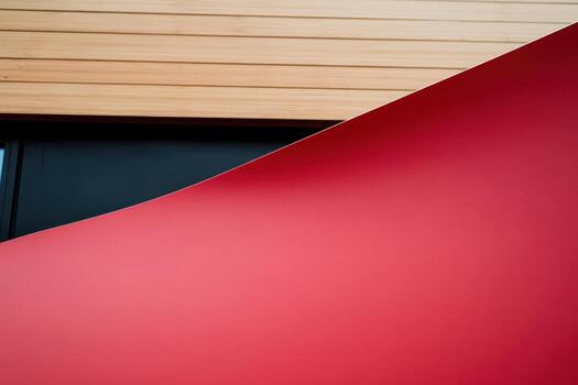 Abstract design with red curves on a wooden backdrop in modern space photo
