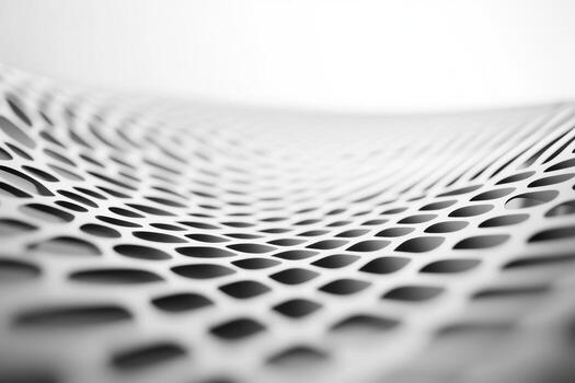 Detailed close-up of a modern perforated surface showcasing intricate patterns photo