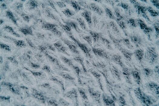Close-up view of textured white fabric showcasing intricate patterns and fibers photo